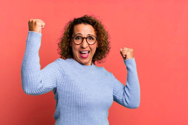 Photo shouting triumphantly looking like excited happy and surprised winner celebrating