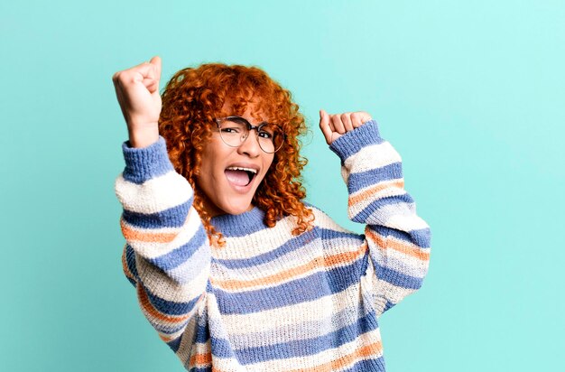 Photo shouting triumphantly looking like excited happy and surprised winner celebrating