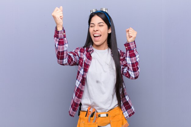 shouting triumphantly, looking like excited, happy and surprised winner, celebrating