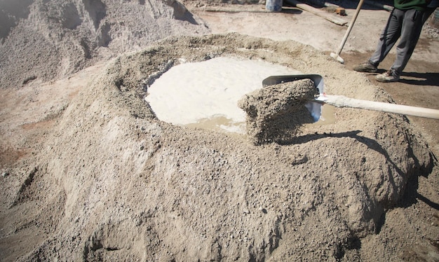 Shovel with a cement Construction site
