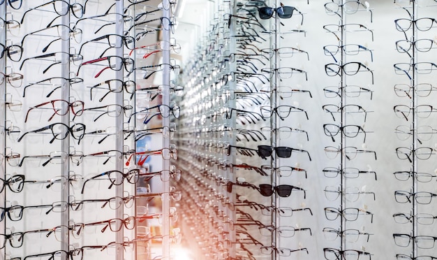 Showcase with spectacles in modern ophthalmic store Closeup