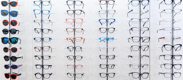 Showcase with spectacles in modern ophthalmic store Eyeglasses shop Eyesight correction