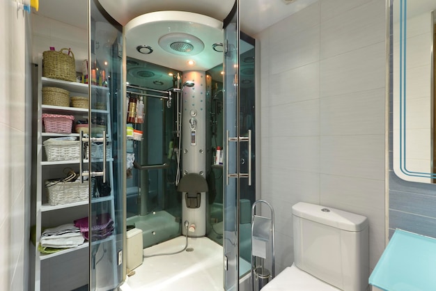 Shower cabin with hydromassage jets lamps seat and radio and towel rack
