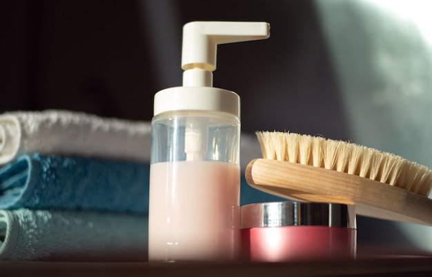 Shower facilities and a stack of clean towels in the bathroom Body care concept