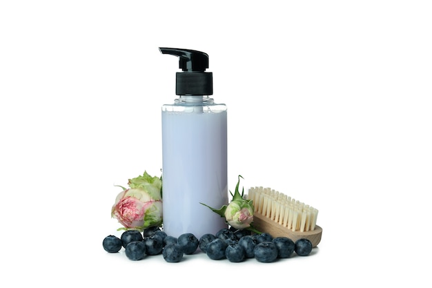 Shower gel, brush, rose and blueberry isolated on white background