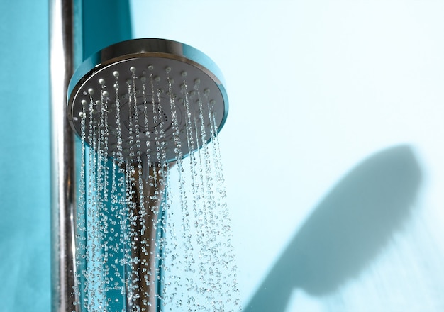 Shower head in bathroom with water stream