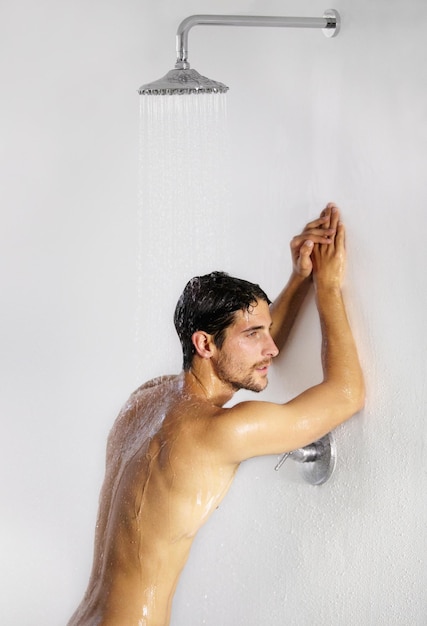 Photo shower man rest and bathroom with body cleaning and soap in the morning in home water young male person and smile with hygiene and clean skin care in house with cosmetic grooming and shaving foam