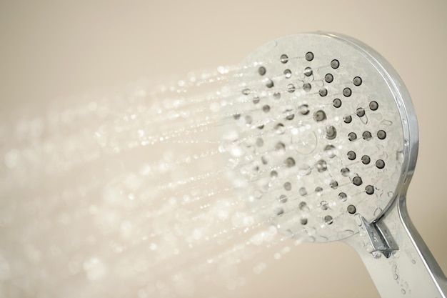 Shower with strong water flow in the bathroom