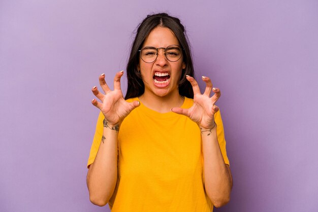 Showing claws imitating a cat aggressive gesture