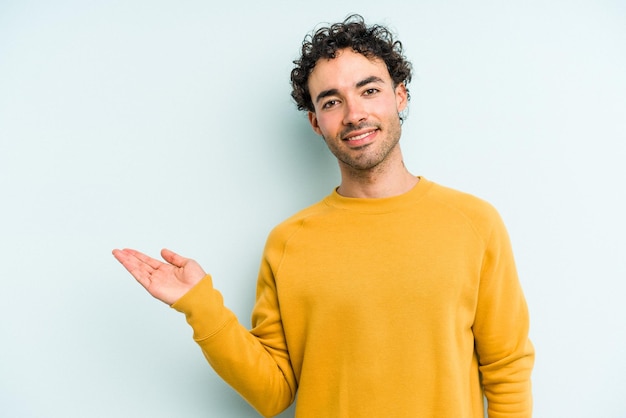 Showing a copy space on a palm and holding another hand on waist