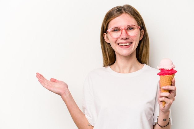 Showing a copy space on a palm and holding another hand on waist