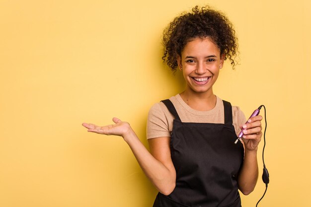 Showing a copy space on a palm and holding another hand on waist