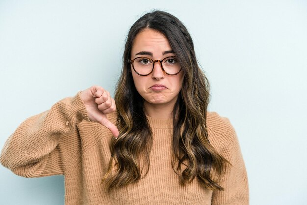 Photo showing a dislike gesture thumbs down disagreement concept