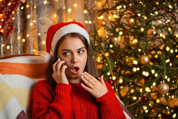 Photo showing emotions while talking over the phone, bright facial expression of surprise and indignation