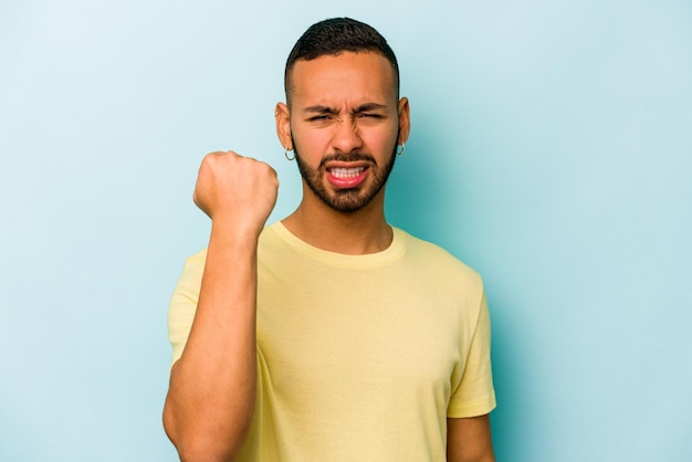 Showing fist to camera aggressive facial expression