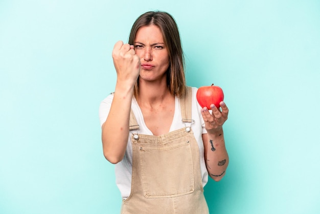 Showing fist to camera aggressive facial expression