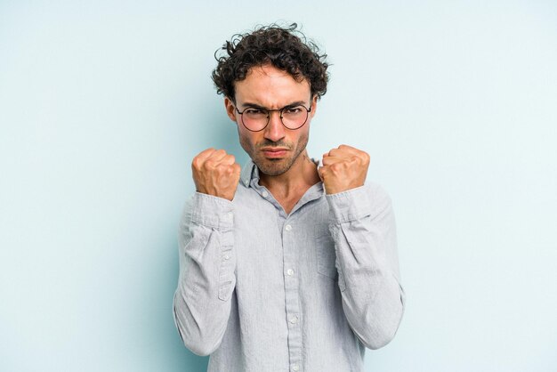 Showing fist to camera aggressive facial expression