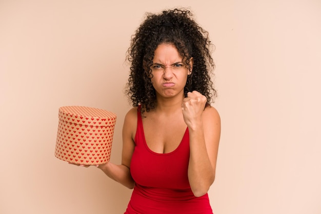 Showing fist to camera aggressive facial expression