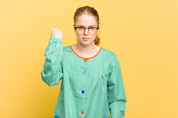 Showing fist to camera aggressive facial expression