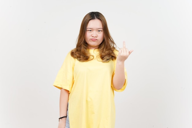 Showing fuck hand of Beautiful Asian Woman wearing yellow TShirt Isolated On White Background