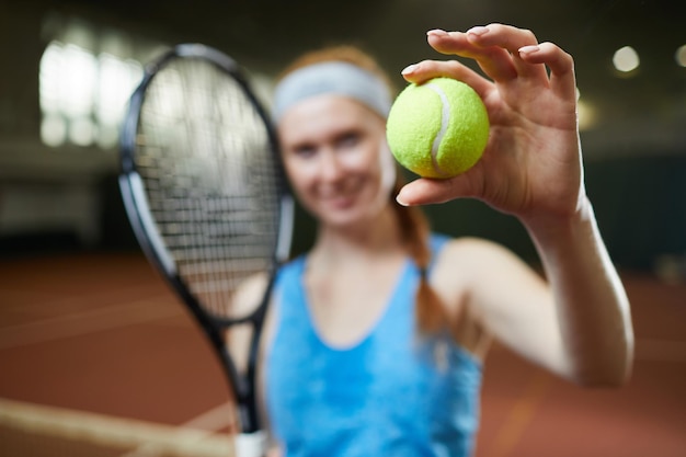 Showing green tennis ball