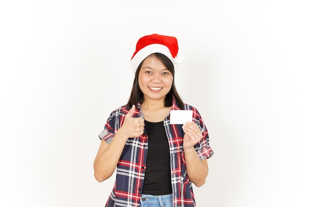 Showing and Holding Blank Credit Card of Beautiful Asian Woman Wearing Red Plaid Shirt and Santa Hat