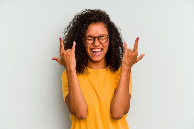 Showing a horns gesture as a revolution concept