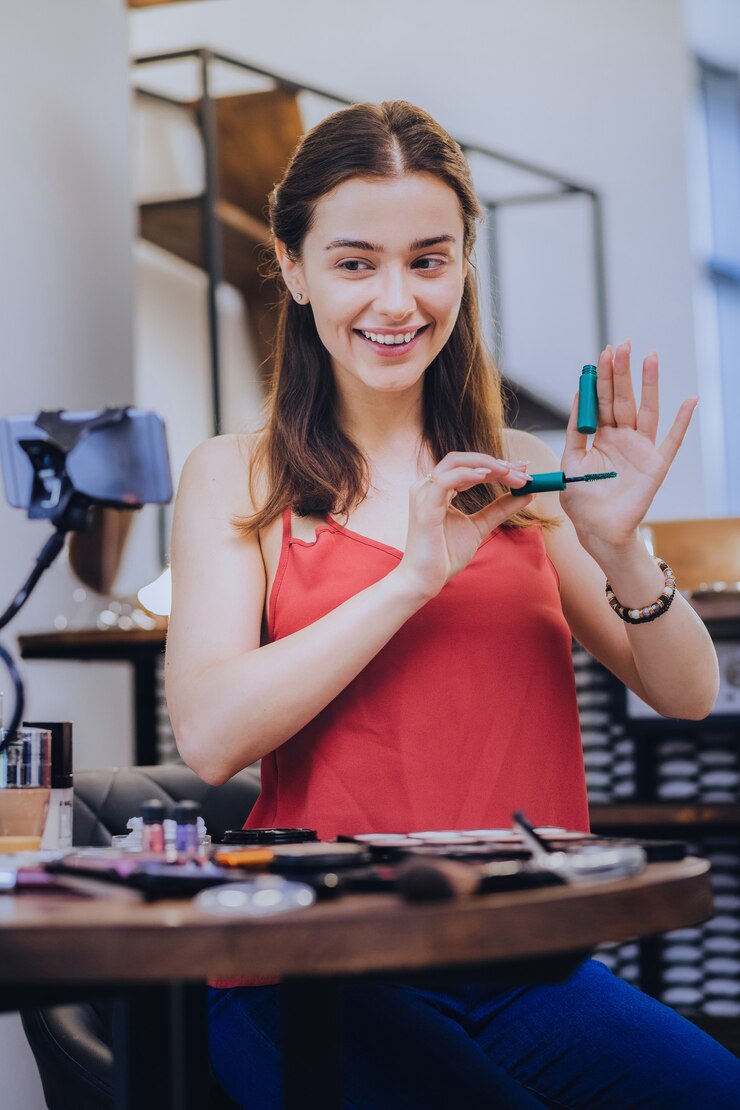 फोटो showing mascara. smiling beautiful beauty blogger showing her best eye mascara her followers