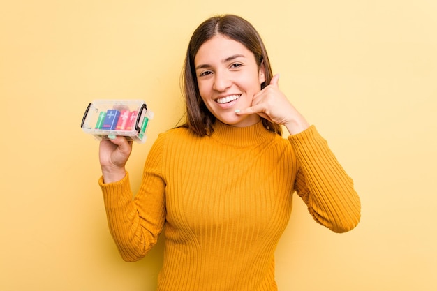 Showing a mobile phone call gesture with fingers