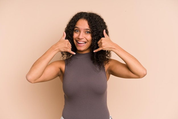 Showing a mobile phone call gesture with fingers