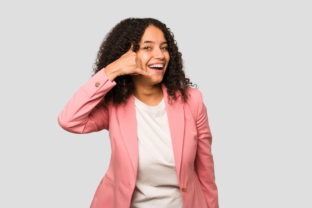 Showing a mobile phone call gesture with fingers