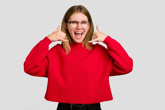 Photo showing a mobile phone call gesture with fingers