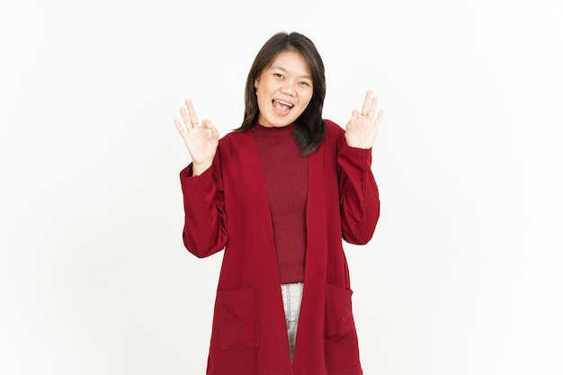 Showing Ok Sign Of Beautiful Asian Woman Wearing Red Shirt Isolated On White Background