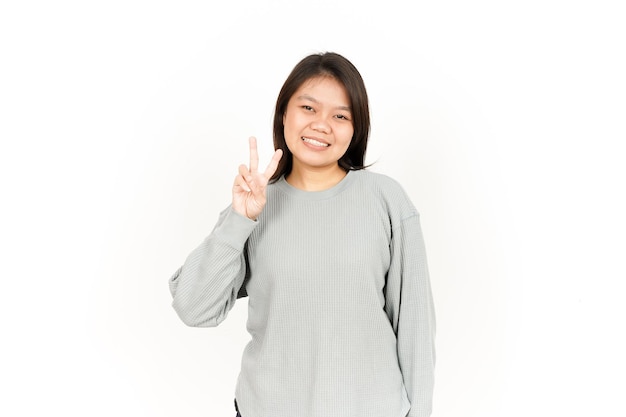 Showing Peace Sign Of Beautiful Asian Woman Isolated On White Background