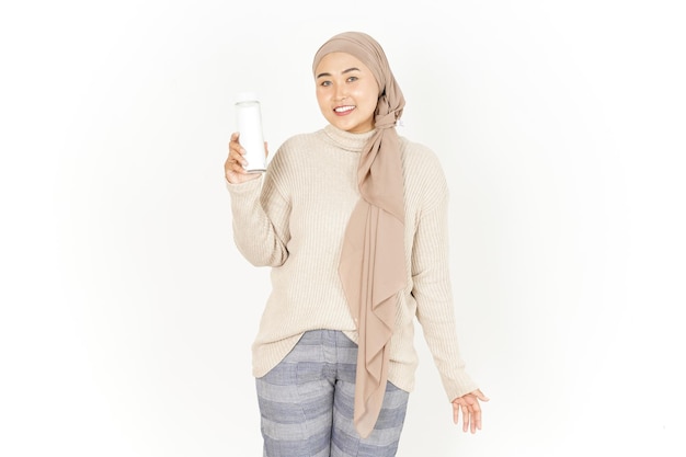 Showing and presenting blank bottle of Beautiful Asian Woman Wearing Hijab Isolated On White Background