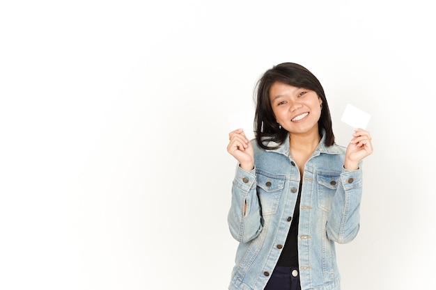 Showing Presenting and Holding  Blank Credit Card of Beautiful Asian Woman Wearing Jeans Jacket