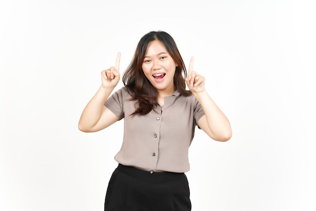 Showing Product and pointed upwards Of Beautiful Asian Woman Isolated On White Background