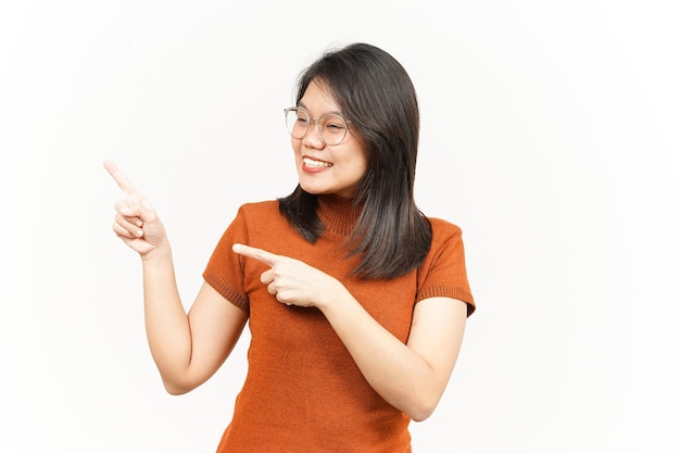 Showing Product and Pointing Side Of Beautiful Asian Woman Isolated On White Background