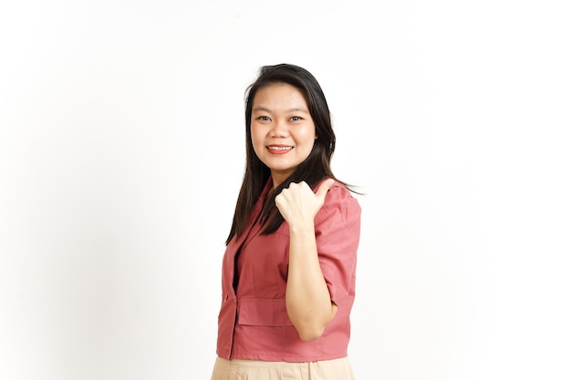 Showing Product and Pointing Side using Thumb Of Beautiful Asian Woman Isolated On White Background