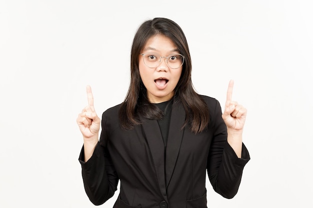 Showing Product and Pointing Up Of Beautiful Asian Woman Wearing Black Blazer Isolated On White