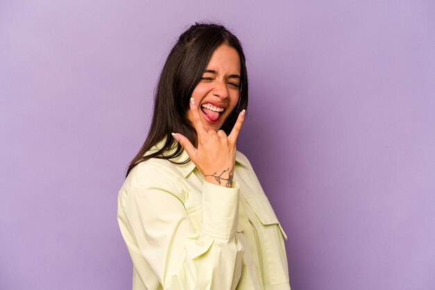 Showing rock gesture with fingers