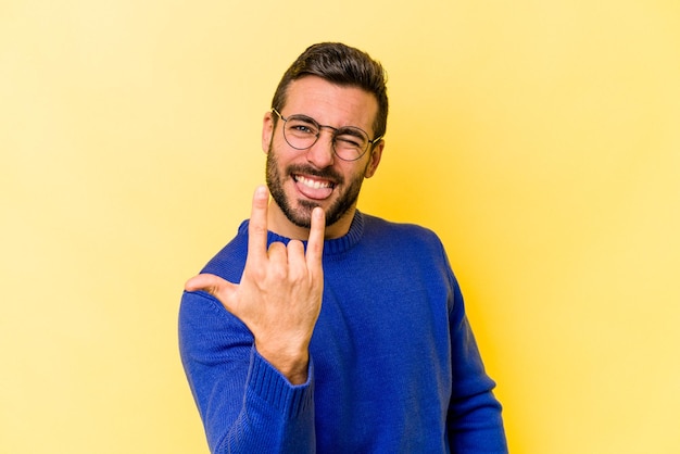 Showing rock gesture with fingers