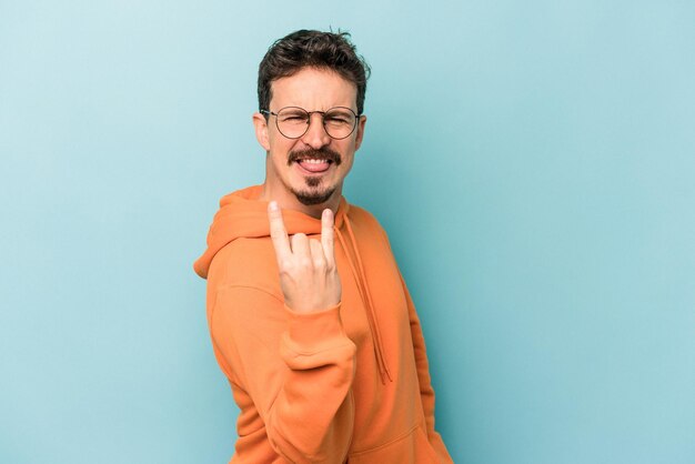 Showing rock gesture with fingers