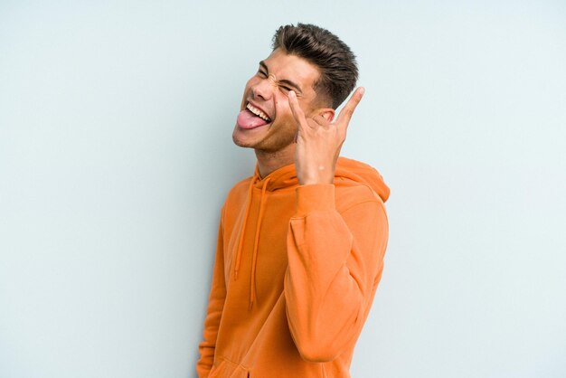 Showing rock gesture with fingers