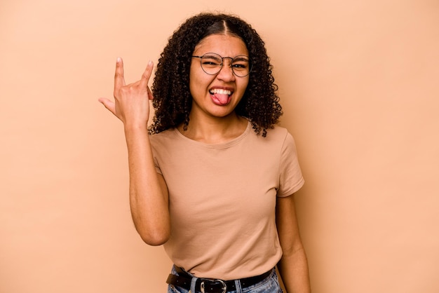 Showing rock gesture with fingers