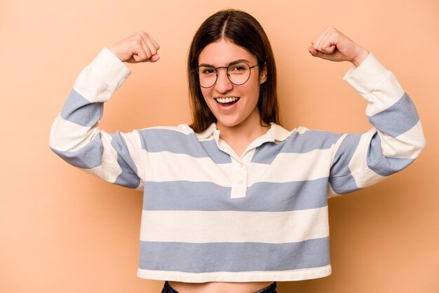 Showing strength gesture with arms symbol of feminine power