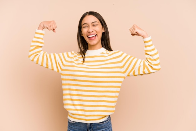 Showing strength gesture with arms symbol of feminine power