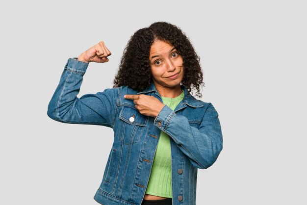 Showing strength gesture with arms symbol of feminine power