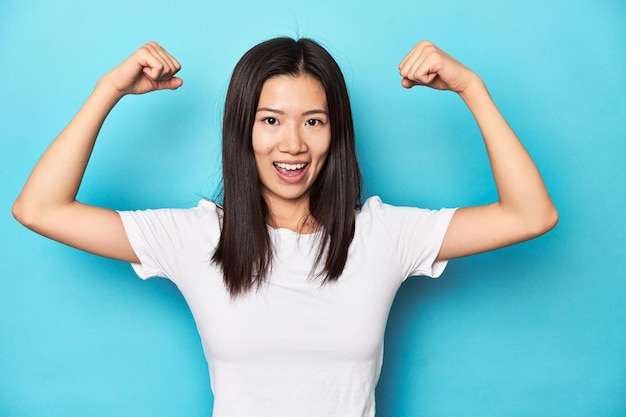 Showing strength gesture with arms symbol of feminine power