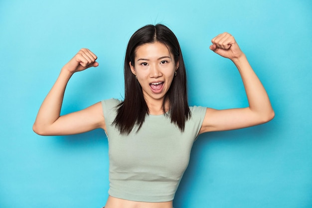 Showing strength gesture with arms symbol of feminine power